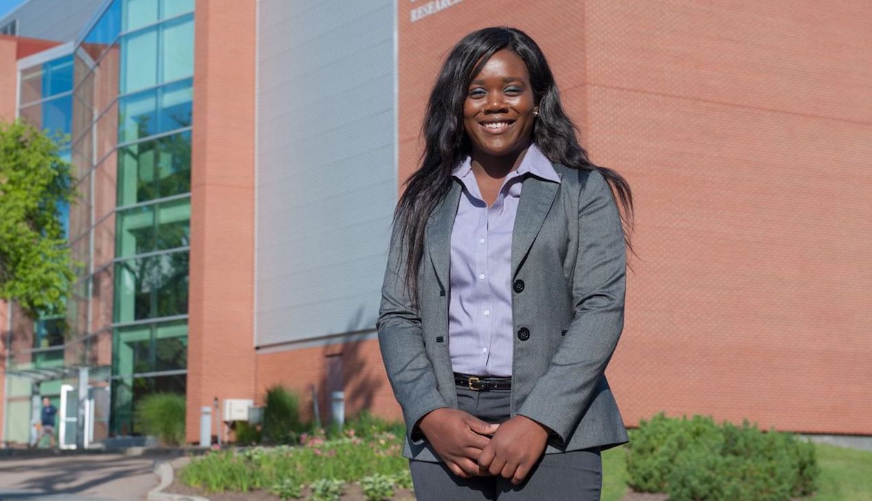 co-op student in front of research centre