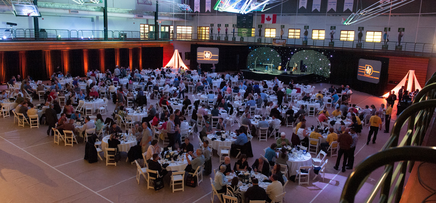 Gymnasium filled with tables for an event