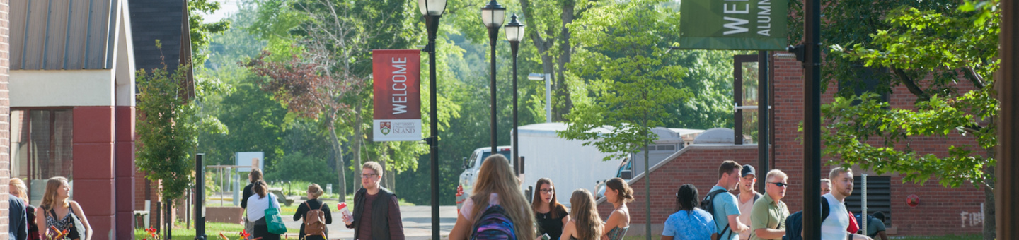 students in the quad in front of steel building 