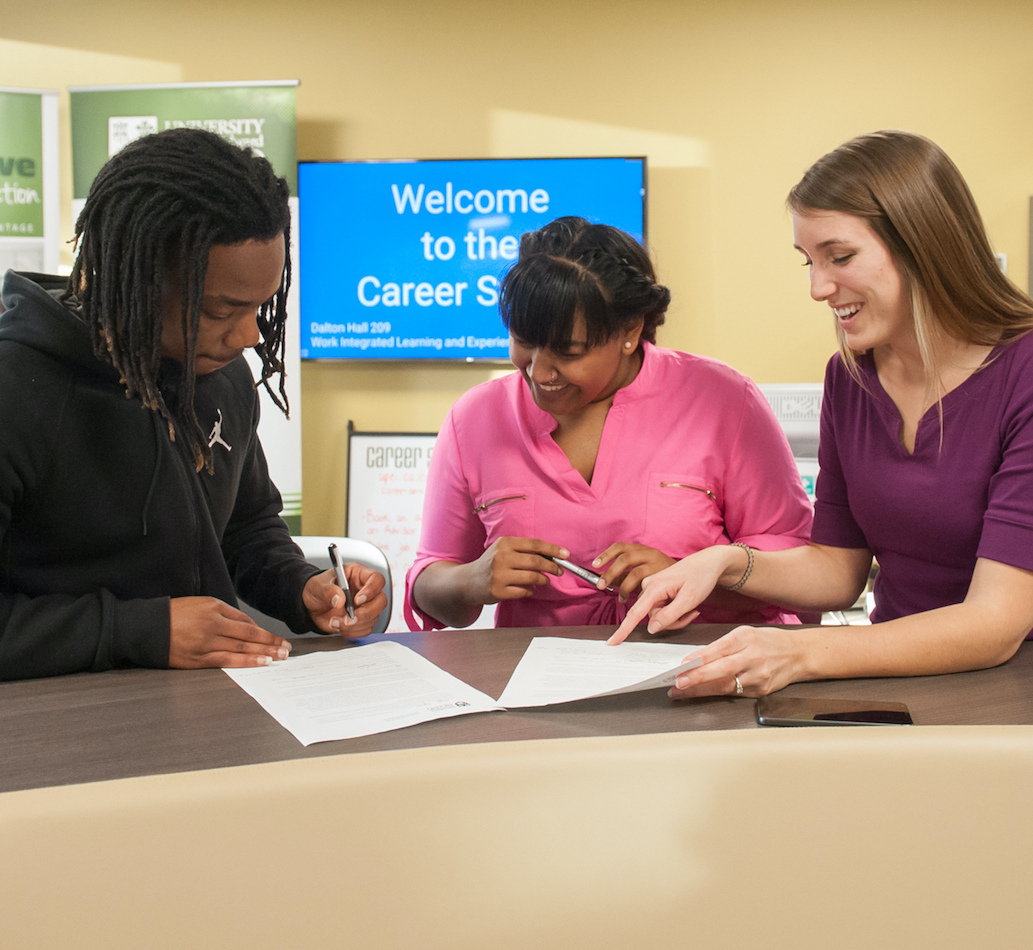 three students at the reer studio