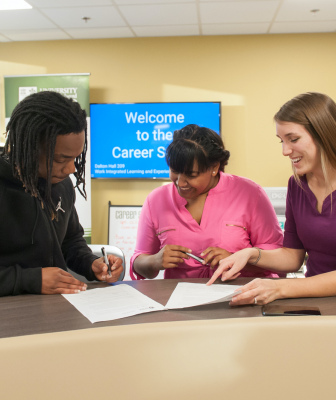 three students at the reer studio