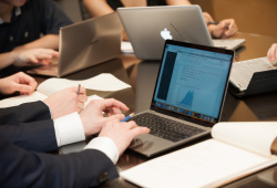 a student typing on a laptop computer