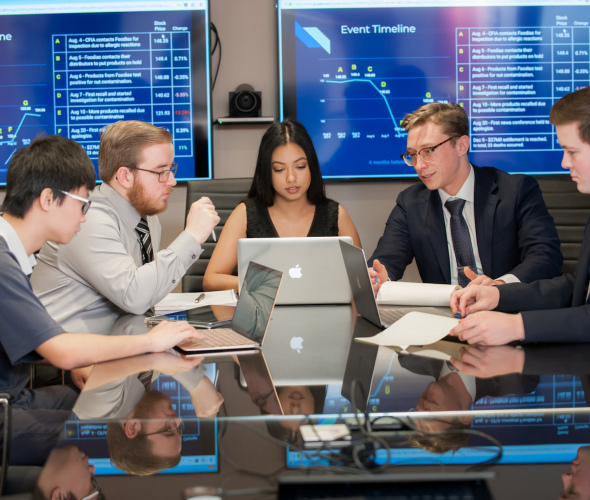 students meeting in a boardroom 