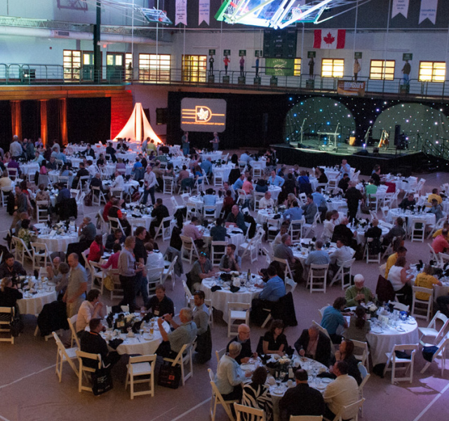 Gymnasium filled with tables for an event