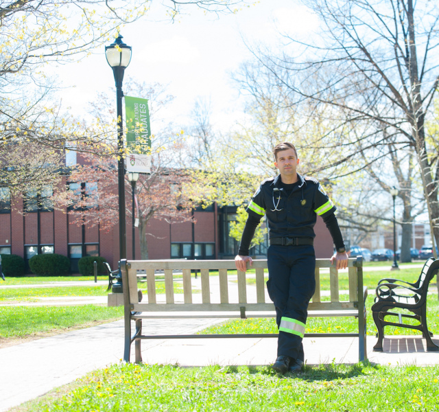 male paramedic standing in the BCA quad