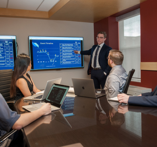 math students meeting at boardroom table